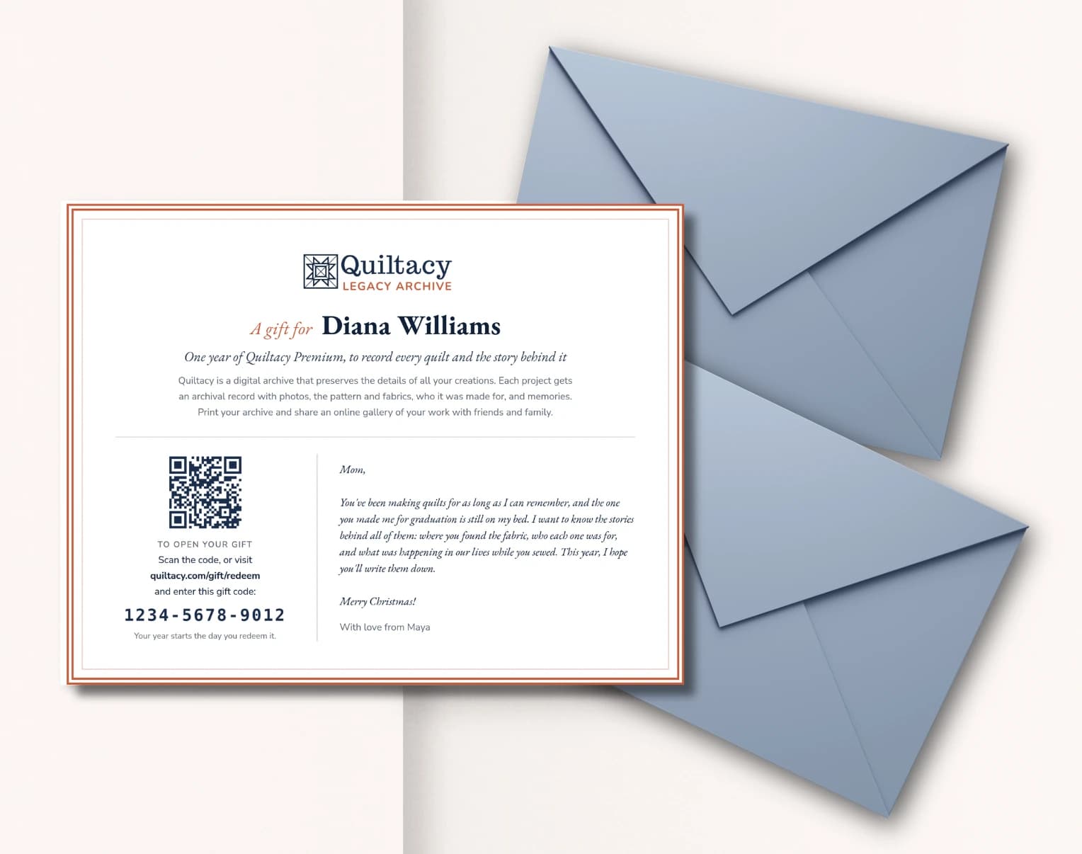 A printed Quiltacy gift certificate for Diana Williams, with a QR code, a gift code and a Christmas note from Maya, beside two blue envelopes