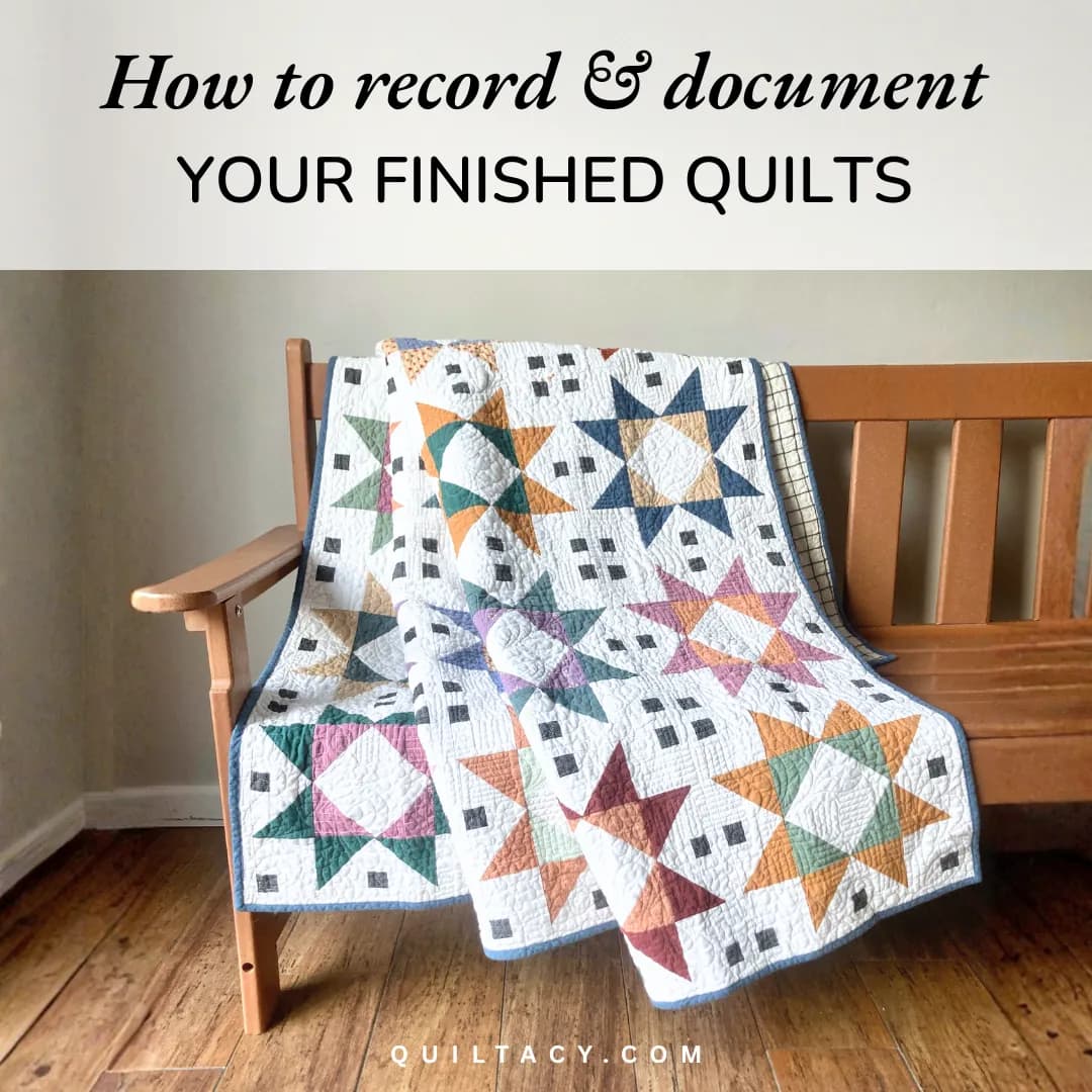 A colorful star-block quilt folded over a wooden bench